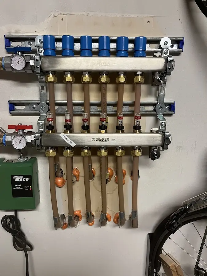 Plumber performing Water Heater Repair at a residential property in Wilson